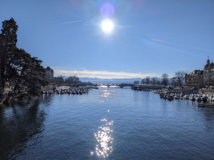 Sun and alps over the Limmat river and the Zürich lake
